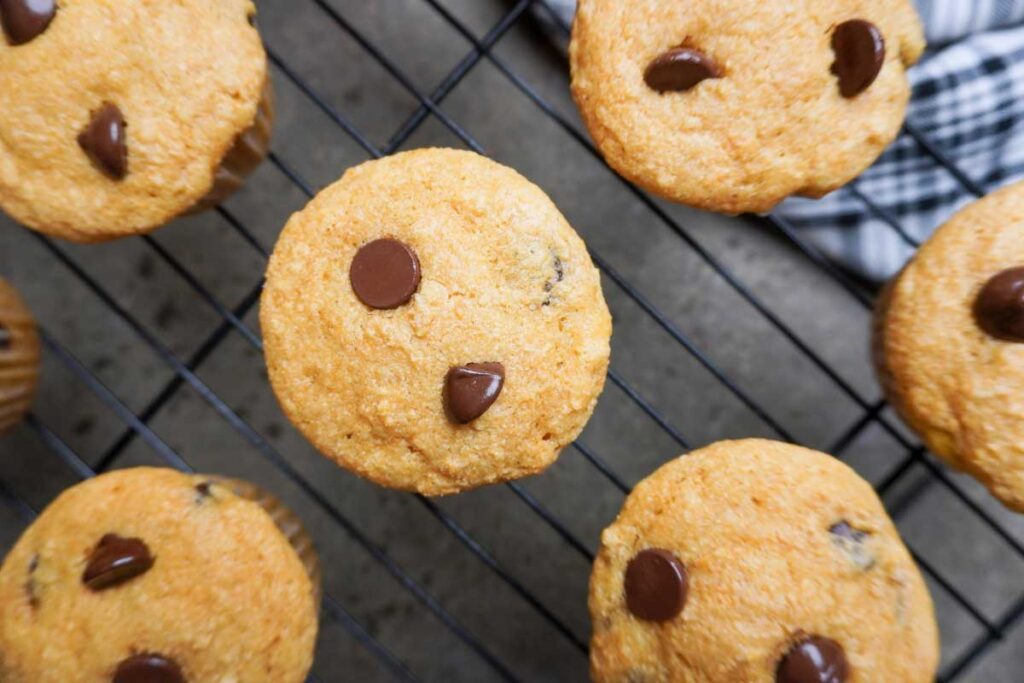 Top view of muffins made with fresh milled flour, cooling on a wire rack
