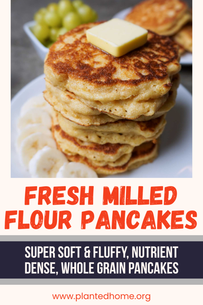 image of fluffy fresh milled flour pancakes in a stack with butter. text that says "fresh milled flour pancakes"