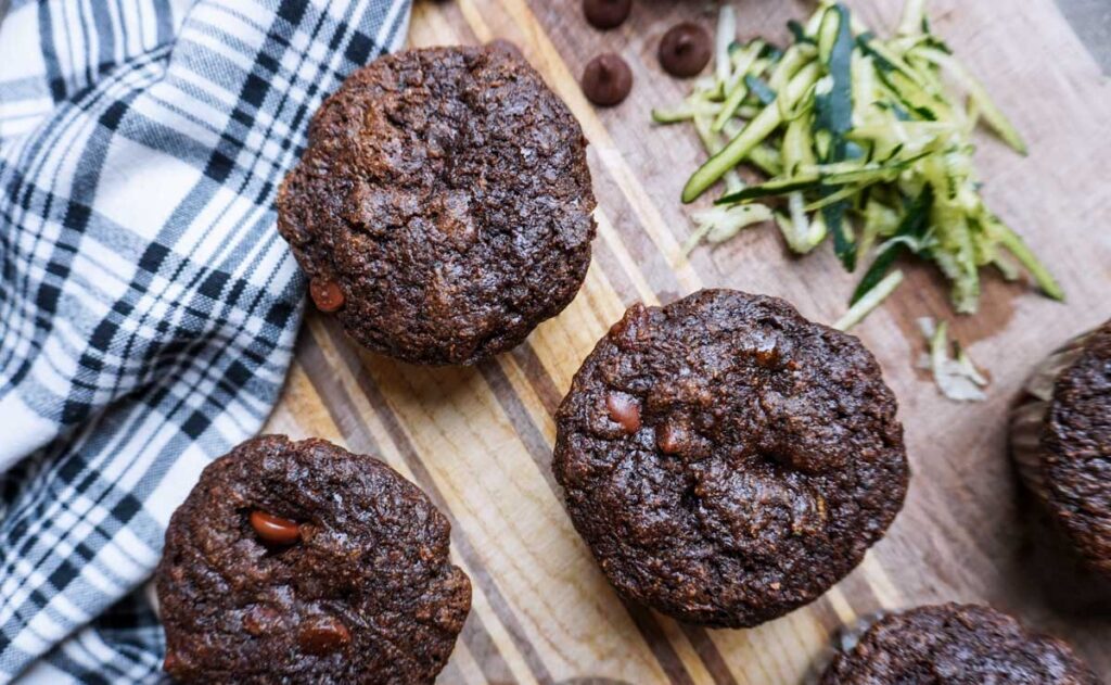 Top view of chocolate sourdough discard muffins with zucchini and fresh milled flour.