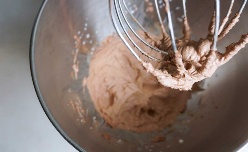 Chocolate cream cheese frosting in a stand mixer.