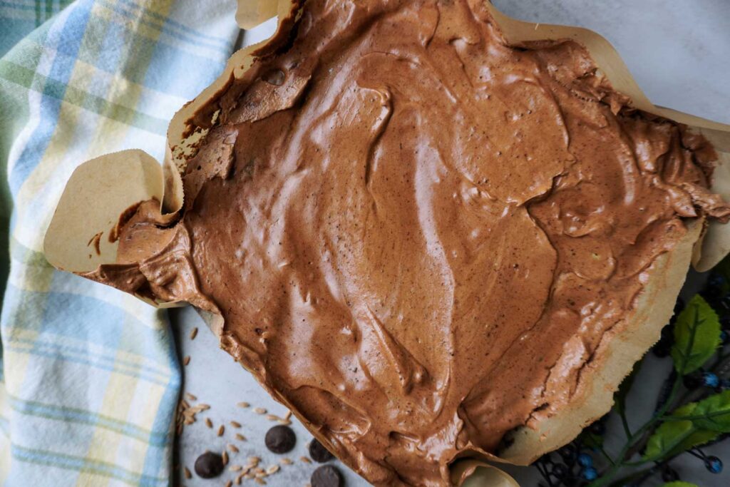 Pan of brownies covered in frosting.