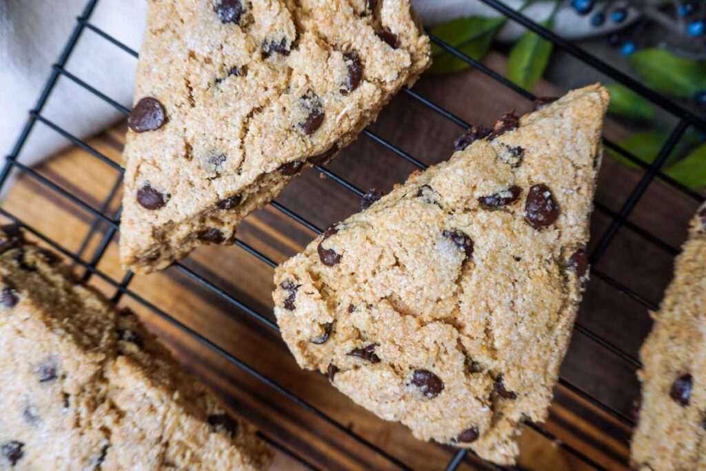 Close up of fresh milled chocolate chip scones on a cooling rack
